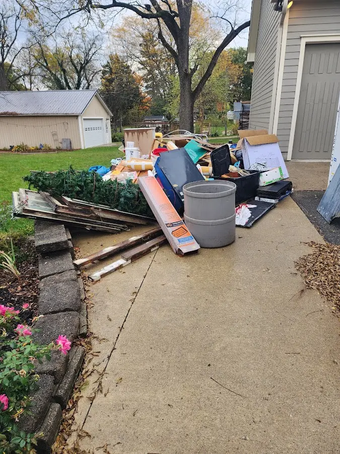 Dumpster being loaded with debris for Demolition Dumpster Rental in Cuyahoga Falls